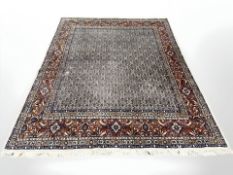 A Kashan carpet, Central Iran, the dense ivory field with all-over Herati pattern,