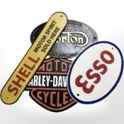 Four reproduction painted cast iron signs, to include Shell, Harley Davidson, Norton and Esso,
