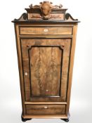 A 19th century continental walnut and ebonised single door cabinet, 80 cm x 41 cm x 171 cm.
