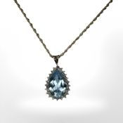 A 9ct yellow gold synthetic aquamarine pendant on 9ct yellow gold chain, length 46 cm.