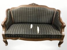 An early 20th century mahogany salon settee,