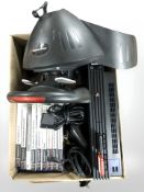 A Playstation 2 console, controllers and various games.