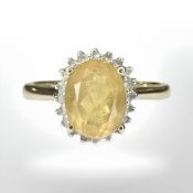 A 9ct yellow gold cluster ring set with a synthetic yellow stone, size N/O.