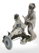 A Lladro figure group of two geishas on a wooden bridge,