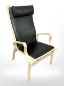 A Danish bentwood lounge armchair in black vinyl upholstery.
