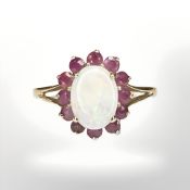 A 9ct yellow gold synthetic white opal cluster ring size L/M. CONDITION REPORT: 1.7g.