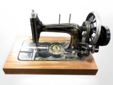 An early 20th century continental hand sewing machine.