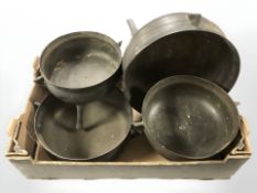 Four 19th century patinated metal cooking pots / cauldrons.