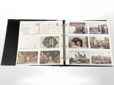 An album containing approximately 204 antique and later postcards, oilettes, Rafael Tuck, etc.