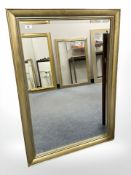 A contemporary bevelled mirror, 72 cm x 103 cm.