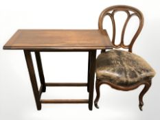 A mahogany side table and studded leather upholstered chair on cabriole legs