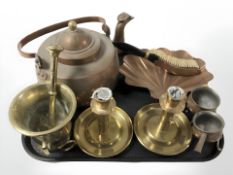 A copper kettle, pair of brass chamber sticks, pestle and mortar, and other metal wares.
