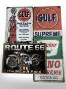 Four reproduction tin motoring signs, largest 30 cm long.