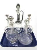 Five various decanters, two with etched decoration.
