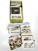 A shoebox containing in excess of 500 various postcards.