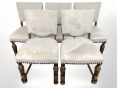 A set of five continental oak dining chairs in studded fabric.