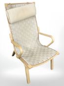 A Danish bentwood lounge armchair with canvas webbed seat.