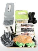 An Xbox 360 console, with controllers, various games and Guitar Hero game.