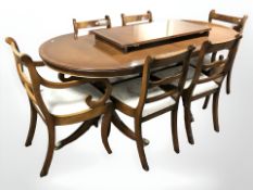 A reproduction Bevan Funnell twin pedestal extending dining table with leaf,