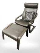 An IKEA stained laminated wood and brown stitch leather arm chair and matching footstool.