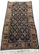 A Balouch rug, Afghanistan, 215 cm x 109 cm.