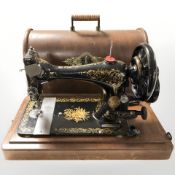 An antique Singer hand sewing machine.