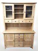 A contemporary oak dresser, 130 cm x 48 cm x 190 cm.