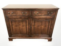 A reproduction Bevan Funnell stained yew wood sideboard,