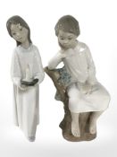 A Lladro figure of a boy in night dress sat on a tree stump,