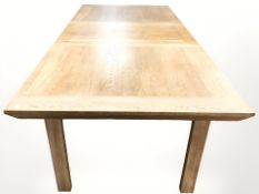 A contemporary oak extending dining table with leaf, total length 200 cm x 90 cm x 79 cm,