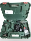 A Bosch power drill, pneumatic gun and torch in fitted carry case.