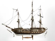 A scale model of a three masted battleship on stand, length 90 cm.