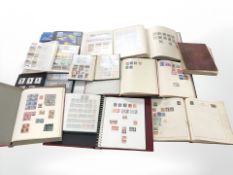 Twelve albums of world stamps.