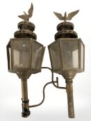A pair of antique brass coaching lamps.