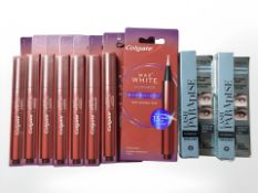 Eight Colgate whitening pens and two L'Oreal mascara packs.