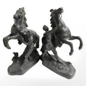 A pair of patinated spelter figures of rearing horses, height 30 cm.