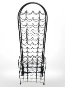 A wire metal wine rack and two further racks, tallest 143 cm.