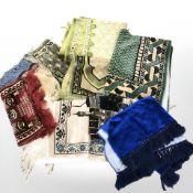 A plastic basket containing assorted throws.