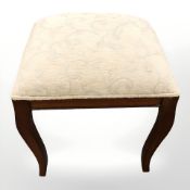 A reproduction mahogany piano stool