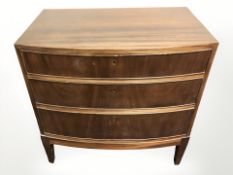 A 20th century continental teak bow front three drawer chest, 72 cm x 47 cm x 72 cm.