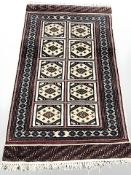 A Lahore Bokhara rug, Pakistan, 177 cm x 100 cm.