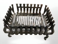 A 19th century cast iron fire basket,