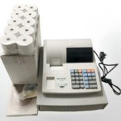 A Sharp XE-A110 cash till, with lead, receipt rolls, etc.