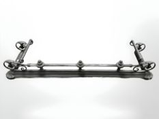 A reproduction painted metal fender, width 137 cm.