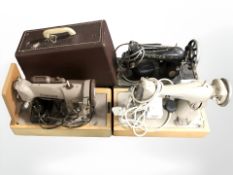 Two vintage Singer electric sewing machines and a Winfield sewing machine.