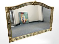 A contemporary over mantle mirror with decorative mirrored frame, 88 cm x 130 cm.