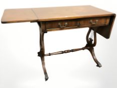 A reproduction mahogany sofa table,