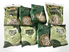 Eight packs of roasted nuts.