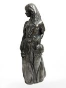 A resin statue of a woman, height 23 cm.