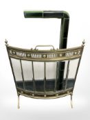 A brass and glass bow front fire screen, and a tiled fire curb, inner width 76 cm.